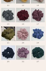 Catalog view of multiple solid color chiffon hair scrunchies in various shades