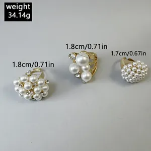 Detail view of 3-piece Baroque pearl and rhinestone ring set showing weight and size
