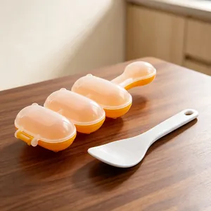 Detailed view of the orange 3-slot DIY rice ball shaker mold with white mini rice paddle
