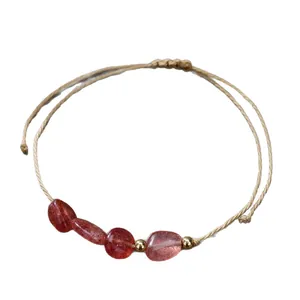 Handmade braided friendship bracelet with natural red strawberry stones and gold beads