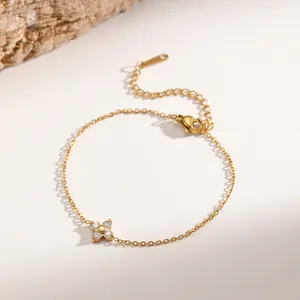 Elegant 18K gold plated titanium steel necklace featuring a mini zircon four-leaf clover.