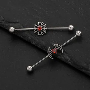 Detailed view of punk style industrial barbells with spider web and devil wing designs
