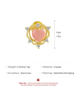 Detail of gold-toned heart clip-on earring with pink heart and sparkling zirconia accents.
