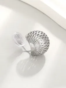 Macro view of minimalist silver hollow sphere earring with comfortable mosquito coil clip