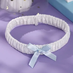 Elegant white ruffled elastic bridal leg garter with light blue ribbon bow and pearl bead