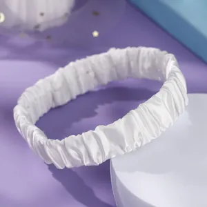 Elegant white satin elastic garter leg band accessory for bridal and photography use.