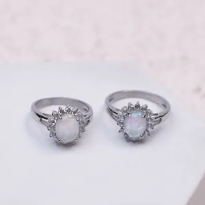 Elegant 316L stainless steel sunflower rings featuring luminous oval white opal stones.