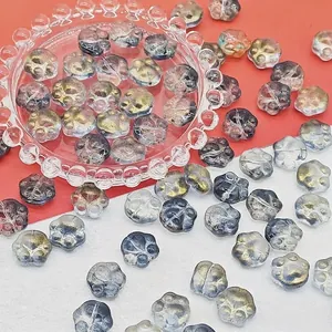 Detailed macro view of 14mm gradient lampwork glass cat paw beads for DIY jewelry making.