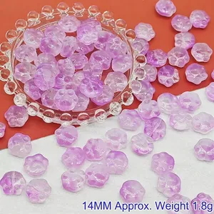 Macro view of purple gradient cat paw shaped glass beads for DIY jewelry making and crafts