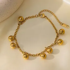 Elegant 18K gold plated titanium steel necklace featuring eight smooth round bead charms