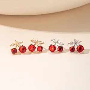 Elegant cherry stud earrings with vibrant red crystals and silver or gold finish