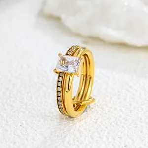 Macro view of gold-plated double-layer ring with sparkling rectangular center stone