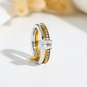 Close-up of double-layered stainless steel ring featuring an oval crystal and pavé stones.