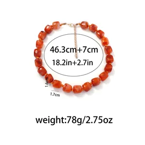 Detailed view of geometric orange resin beaded choker with size and weight specs