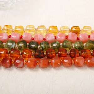 Detail view of colorful geometric resin cubic beads in five different styles