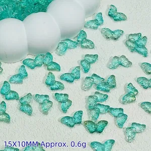 Macro view of 15x10mm transparent turquoise butterfly beads for DIY jewelry making crafts