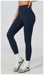 Close-up of high-waisted navy blue yoga leggings showing supportive compression fit