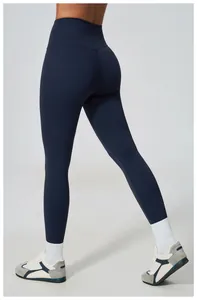 Back view of high-waisted navy blue yoga leggings for women in a fitness setting