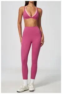 Front detail view of high-waisted pink yoga leggings and sports bra set