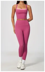 Full view detail of a pink high-waisted yoga leggings and matching sports tank top