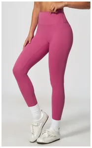 Close-up of high-waisted magenta yoga leggings with breathable quick-dry fabric