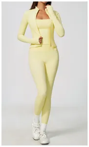 Pale yellow high-waisted yoga set featuring a zip-up jacket and matching leggings