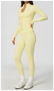 Full view of model wearing a light yellow high waisted yoga set for fitness and running.