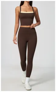 Professional full view of women's high-waisted brown yoga leggings and matching sports top