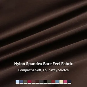 Macro close-up view of brown four-way stretch nylon spandex yoga pant fabric texture