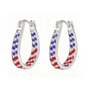 Detailed view of U-shaped hoop earrings with red, white, and blue rhinestones