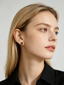 Close-up view of elegant S925 sterling silver black flower stud earring on model
