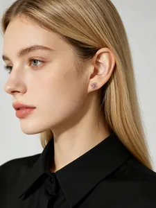Detail view of pink flower stud earrings on model for a dainty and elegant look.