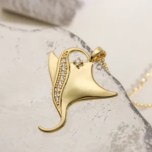 Elegant gold-plated manta ray necklace with sparkling cubic zirconia, ocean inspired charm