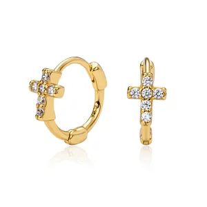 Exquisite detail of gold-plated sterling silver cross hoop earrings with shiny cubic zirconia