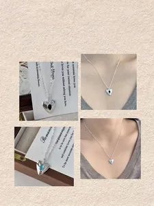 S925 sterling silver heart necklace set with blue and black water-drop crystals.