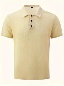 Close-up of a men's beige waffle-knit polo shirt featuring a black button-down collar