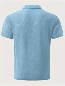 Back view of a light blue waffle knit polo shirt for men showing breathable texture.