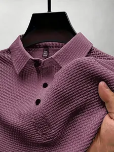 Macro detail of men's purple ice silk polo shirt showing textured mesh waffle fabric