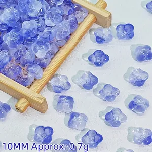 Macro view of 10mm blue glass flower beads for DIY traditional hair accessory making.