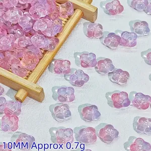 Macro detail showing 10mm pink and purple translucent flower beads for DIY crafts