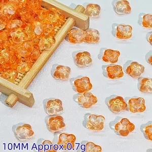 Detailed view of 10mm orange translucent glass flower beads for DIY hair stick jewelry making