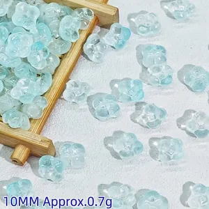 Macro view of 10mm translucent light blue glass flower beads for DIY craft making