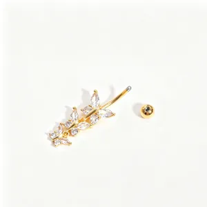 Detailed macro view of a gold-finished navel ring featuring three zirconia butterflies.