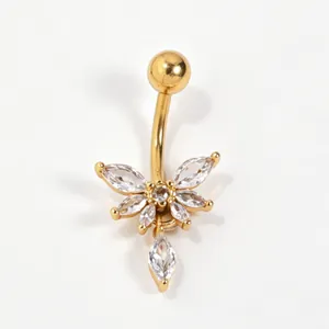 Detail shot of a gold butterfly navel piercing with dangling clear marquise zircons.