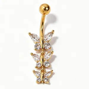 Detailed view of gold belly ring with three stacked marquise-cut zircon butterfly charms.