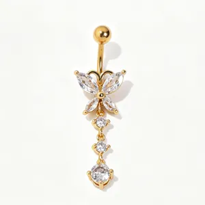 Close-up of gold-plated belly ring with zircon butterfly and dangling crystal charms