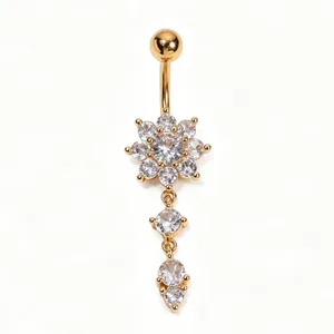 Detailed macro view of a stylish gold flower navel ring with sparkling zircon tassels