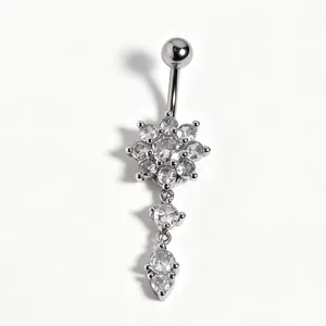 Detailed macro view of a silver navel ring featuring a sparkling zircon flower cluster