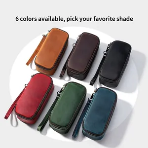 Macro view of six color variations of vintage genuine leather pipe and tobacco storage pouches