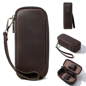 Detailed views of a vintage genuine leather tobacco pipe storage case with wrist strap.